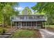 Unique two-story home with screened porch, upper deck, and lovely landscaping at 4043 Windward Dr, Fort Mill, SC 29708