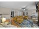 Spacious living room with a large sectional sofa, area rug, and fireplace, offering a cozy and inviting atmosphere at 4043 Windward Dr, Fort Mill, SC 29708