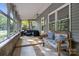 Relaxing screened-in porch featuring tiled floors, comfortable seating, and ample natural light at 4043 Windward Dr, Fort Mill, SC 29708