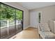 Bright sitting area with access to the outdoor deck, featuring a comfy chair and lots of natural light at 4043 Windward Dr, Fort Mill, SC 29708