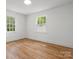 Spacious bedroom with hardwood floors and bright windows offering natural light at 4126 Howie Cir, Charlotte, NC 28205