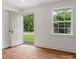 Bright entryway features refinished wood floors, fresh paint, and a new door at 4126 Howie Cir, Charlotte, NC 28205