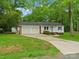 Well-maintained home with a two-car garage, green lawn, and a welcoming front entrance at 4126 Howie Cir, Charlotte, NC 28205