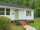 Welcoming home exterior with a brick stairway and landscaped front yard at 4126 Howie Cir, Charlotte, NC 28205