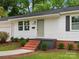 Charming single-story home featuring a brick stairway and a well-manicured lawn at 4126 Howie Cir, Charlotte, NC 28205