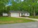Charming single-Gathering home with a two-car garage, beautiful lawn, and inviting curb appeal at 4126 Howie Cir, Charlotte, NC 28205