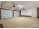 Spacious garage with two car capacity, epoxy floors and two automatic overhead doors at 4126 Howie Cir, Charlotte, NC 28205