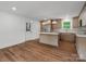 Bright kitchen features wood floors, an island and stainless steel appliances at 4126 Howie Cir, Charlotte, NC 28205