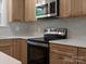Close up of kitchen featuring stainless steel oven and microwave at 4126 Howie Cir, Charlotte, NC 28205