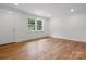 Bright living room featuring refinished wood floors, and freshly painted walls at 4126 Howie Cir, Charlotte, NC 28205