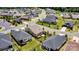 Aerial view of a residential neighborhood with well-maintained lawns, tree-lined streets, and houses with decks and patios at 4197 Canopy Creek Dr, Denver, NC 28037