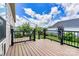 View of home's back deck, railing and natural lighting and view of backyard area and fence at 4197 Canopy Creek Dr, Denver, NC 28037