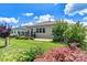 Backyard featuring lush lawn, plants, a black metal fence, a patio, and a cozy deck for outdoor enjoyment at 4197 Canopy Creek Dr, Denver, NC 28037