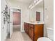Bathroom featuring double vanity, tiled flooring, a shower, and a separate toilet at 4197 Canopy Creek Dr, Denver, NC 28037