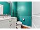 Stylish half-bath features a marble vanity, modern fixtures, and a bold color palette at 4197 Canopy Creek Dr, Denver, NC 28037