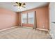 Bedroom featuring plush carpet, a window, and a door at 4197 Canopy Creek Dr, Denver, NC 28037