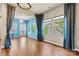 Bright dining room featuring large windows, modern lighting fixtures, and an open space at 4197 Canopy Creek Dr, Denver, NC 28037