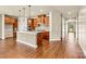 Open concept kitchen with an island, modern cabinets, stainless steel appliances, and hardwood floors at 4197 Canopy Creek Dr, Denver, NC 28037
