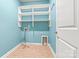 Convenient laundry room features ample shelving and includes washer and dryer hookups for easy laundry management at 4197 Canopy Creek Dr, Denver, NC 28037