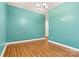 Spacious living room showcases beautiful wood flooring, providing a warm and inviting atmosphere for gatherings at 4197 Canopy Creek Dr, Denver, NC 28037