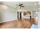 Spacious open-concept design with wood floors seamlessly connecting the living room and kitchen at 4197 Canopy Creek Dr, Denver, NC 28037