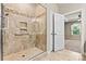 The glass door shower has a built-in shelf and decorative tile at 4197 Canopy Creek Dr, Denver, NC 28037
