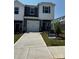 Charming two-story home with a one-car garage and well-maintained front lawn at 4216 Summit Woods Dr, Charlotte, NC 28216