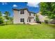 Exterior rear view of a two-story home with fenced yard and lush lawn at 424 Castlebury Ct, Clover, SC 29710