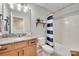 Cozy bathroom with granite countertop vanity and striped shower curtain at 424 Castlebury Ct, Clover, SC 29710