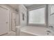 Bright bathroom with a separate shower and tub, plus crisp white trim and clean fixtures at 424 Castlebury Ct, Clover, SC 29710