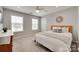 Bright bedroom with two windows and neutral walls and decor at 424 Castlebury Ct, Clover, SC 29710