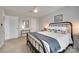 Charming bedroom featuring a black metal frame bed and neutral decor at 424 Castlebury Ct, Clover, SC 29710