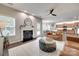 Open-concept living space with a fireplace, dining area, and modern kitchen at 424 Castlebury Ct, Clover, SC 29710