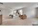 Spacious main bedroom with carpeted floors and a cozy seating area, creating a relaxing retreat at 424 Castlebury Ct, Clover, SC 29710