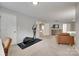 Inviting sitting area featuring access to exercise and entertainment, with access to the rest of the house at 424 Castlebury Ct, Clover, SC 29710