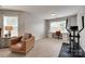 Inviting sitting area with a comfortable chair and desk nook, bathed in natural light at 424 Castlebury Ct, Clover, SC 29710
