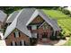 Charming two-story brick home features a classic design with double front doors and well-maintained landscaping at 4359 Whitetail Ln, Midland, NC 28107