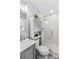 Bright bathroom featuring a vanity, a tile-enclosed glass shower, and modern fixtures at 44092 Woodhurst Rd, New London, NC 28127
