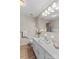 Bathroom featuring large mirror, vanity and decorative orchid at 44092 Woodhurst Rd, New London, NC 28127