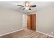 Bedroom featuring hardwood floors and closet with doors at 44092 Woodhurst Rd, New London, NC 28127