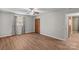 Spacious bedroom with wood flooring, a ceiling fan, and a closet with paneled doors at 44092 Woodhurst Rd, New London, NC 28127