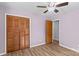 Bedroom featuring hardwood floors and closet with doors at 44092 Woodhurst Rd, New London, NC 28127