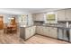 Open layout shows the eat-in-kitchen with an adjacent dining area, and granite countertops at 44092 Woodhurst Rd, New London, NC 28127