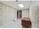 Finished basement area features tile flooring, bright overhead lighting, and neutral colors at 460 27Th Avenue Nw Cir, Hickory, NC 28601