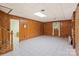 The finished basement has wood paneled walls and access to another room at 460 27Th Avenue Nw Cir, Hickory, NC 28601