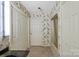 Well-lit bathroom features dual sinks, decorative wallpaper, tub and ample storage at 460 27Th Avenue Nw Cir, Hickory, NC 28601