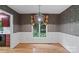 Dining room with hardwood flooring, lovely pendant light, and large window at 460 27Th Avenue Nw Cir, Hickory, NC 28601
