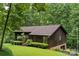 Exterior view of a single Gathering home shows the lush green landscaping and mature trees at 460 27Th Avenue Nw Cir, Hickory, NC 28601