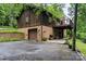 View of the rear of the home showing a garage and elevated deck at 460 27Th Avenue Nw Cir, Hickory, NC 28601