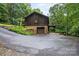 View of the rear of the home showing a garage and elevated deck at 460 27Th Avenue Nw Cir, Hickory, NC 28601